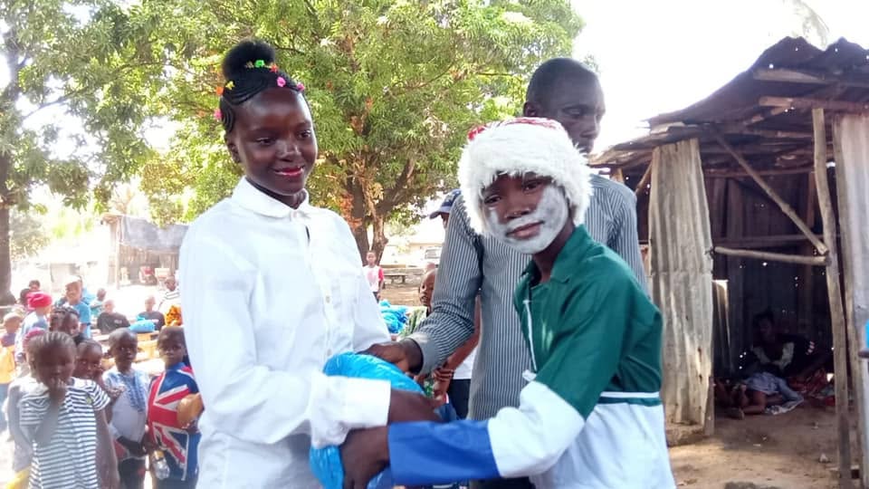A child receiving a gift during a community event